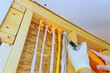 © ungvar - Applying insulation foam to prevent drafts improve energy efficiency in an indoor space during home renovation.