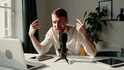 Poster - Professional podcaster recording engaging audio content, capturing dynamic storytelling using high end microphone and laptop while expressing ideas with passionate gestures in slow motion