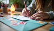 © Denis - Dynamic creative scene featuring a person sealing an envelope with colorful stickers and stamps at a desk adorned with decorative stationery items, illuminated by soft warm indoor lighting