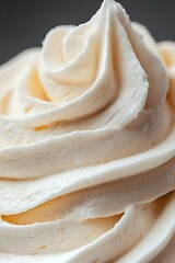 Poster - Creamy vanilla frosting swirls with tiny speckles in macro shot showing soft peaks and smooth texture, perfect for bakery and dessert marketing materials.