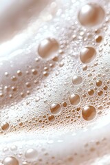 Poster - Macro shot of soap bubbles creating abstract pattern with soft beige and white tones, showing delicate surface tension and spherical formations in foam.