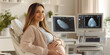 © Mahmood - Pregnant woman at ultrasound appointment in clinic, Expecting mother getting ultrasound at doctor’s office