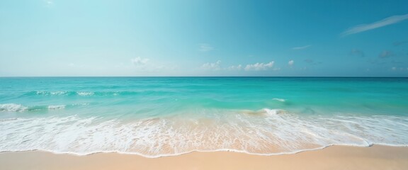 Aufkleber - Clean sandy beach with turquoise ocean, light blue clear skyline. Waves roll gently to coast. Summer vacation destination, relaxing seaside nature background. Seascape view offers tranquility.