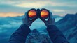 © AGUNG - Sunset view through binoculars atop mountain peak