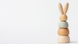 © Chaiwit - easter gift ideas kid. Wooden bunny stacking toy in soft pastel colors for playful learning