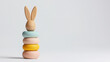 © Chaiwit - easter gift ideas kid. Wooden bunny stacking toy in soft pastel colors for playful learning