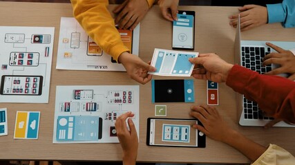 Poster - top view panorama video of startup company employee planning on user interface prototype for mobile 