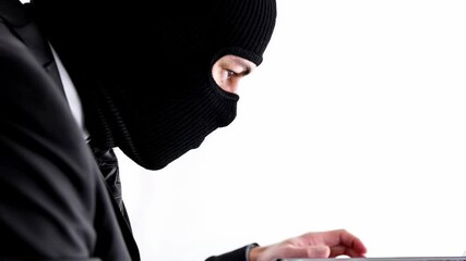 Aufkleber - two men in black suits and masks using laptops against white background