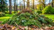 © Praphunsak - A pile of fresh green garden waste like dead branches, leaves and pine needles after spring gardening cleanup in a serene garden landscape , foliage, spring cleanup