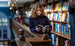 © Alexey Fedorenko - Teenage girl reading the book in the Marylebone bookstore in London, England