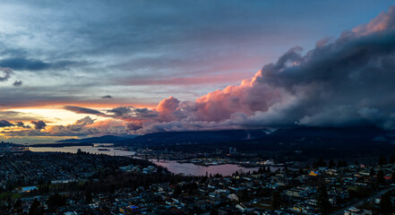 Wall Mural - Breathtaking Sunset Over Vancouver With Dramatic Clouds And Serene Landscape