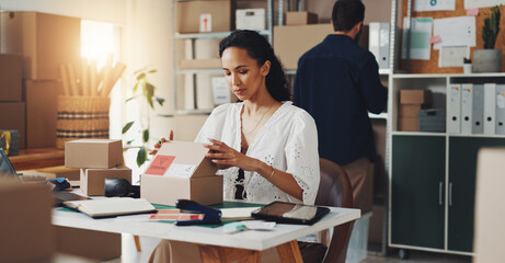 Poster - Woman, courier box and delivery in office, open package and commercial supply chain at desk, Professional, female person and business mail for cardboard distribution, logistics and import goods