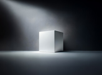 Aufkleber - A white cube stands prominently, bathed in a focused beam of light against a stark, shadowy backdrop. The simple form is highlighted by dramatic illumination and contrast.