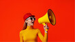 © Stock photos - Confident Woman Shouting Through Megaphone on Bold Red Background