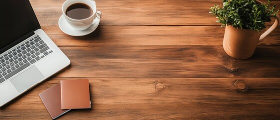 Poster - Businessman working on laptop with coffee and smartphone on wooden table with passport and documents