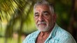 © InspirationDesign - Distinguished senior Mediterranean man in tropical setting. Ideal for retirement lifestyle, travel experiences, and wisdom narratives.