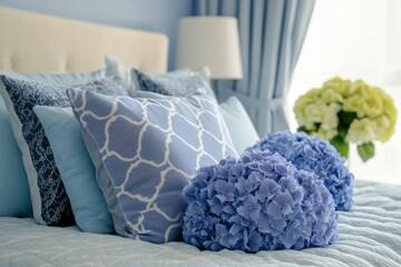 Wall Mural - Blue hydrangea bouquets arranged on a bed with navy blue pillows in a serene bedroom setting