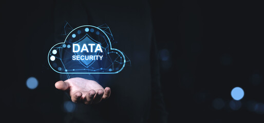 Fototapete - Data security concept with glowing cloud and shield in hand on dark background.