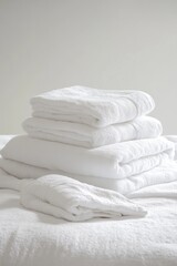 Freshly laundered linens on a bed.