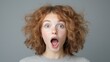 © tugkiara - Woman with surprised expression against neutral background. Possible use for stock photo depicting surprise or emotion