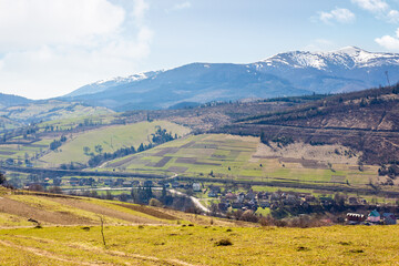 Wall Mural - carpathian countryside scenery with fields on the hills and village in the valley. beautiful view. m