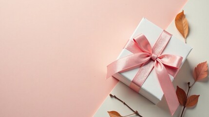 Poster - A delicately tied blush pink ribbon adorns a pristine white gift box, resting on a soft pastel background accented with autumnal leaves and twigs.