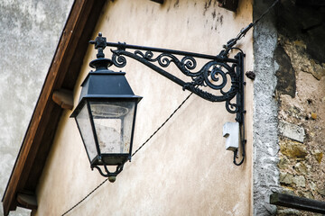 A lamp hanging from a wall in Nancy France