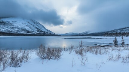 Serene Winter Landscape: Frozen Lake and Snowy Mountains
