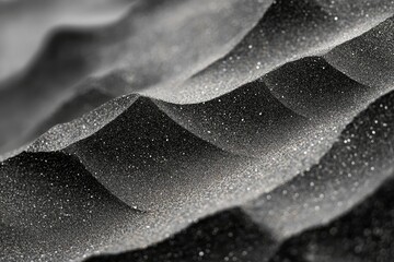 Poster - Abstract grayscale image depicting a textured surface resembling glistening, undulating hills or dunes.