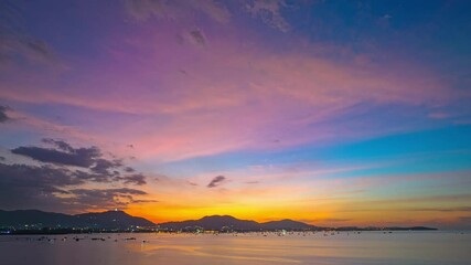 Wall Mural - aerial hyper lapse view of amazing cloud in colorful sky of sunset above the ocean. 
landscape amazing light of nature cloudscape bright sky above Phuket sea.
gradient color texture sky background