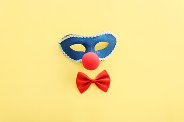 Wall Mural - Holidays image of masquarade mask over yellow background. view from above