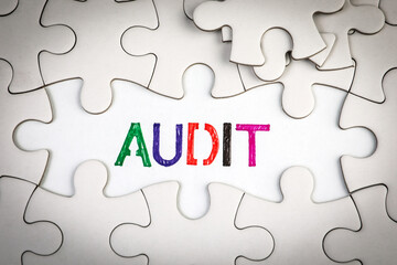 Canvas Print - audit concept. text on a white page. white puzzle pieces