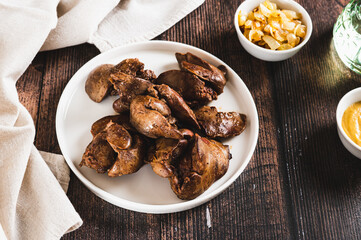 Wall Mural - Homemade stewed chicken liver on a plate on the table