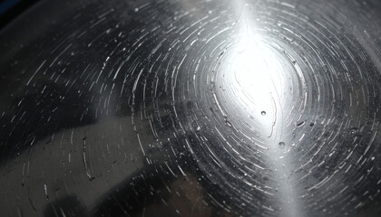 Close-up of reflective metal surface with subtle fingerprint marks and shine