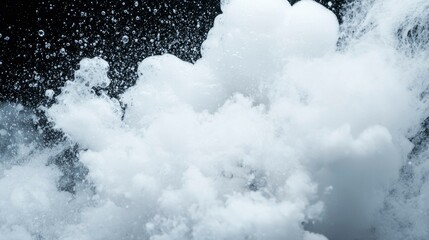 Wall Mural - Abstract explosion of white foam on black background