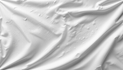 Poster - A close-up view of smooth white fabric, displaying textures and folds. The light gently emphasizes the wrinkles, creating an elegant appearance that enhances any decor