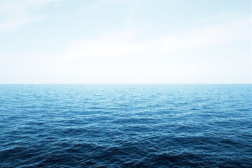 Poster - Serene ocean horizon with light blue sky background.