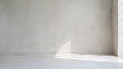 Aufkleber - Minimalist interior with light gray wall and soft natural light streaming through window, creating subtle shadows on smooth floor