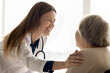 © fizkes - You will be fine. Cheerful woman doctor geriatrician therapist touch shoulder of aged lady patient visiting doc at clinic convince in quick recovery greet with good news positive dynamics in treatment