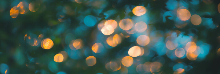 Fototapete - Soft bokeh circles among blurred forest foliage create a serene natural backdrop