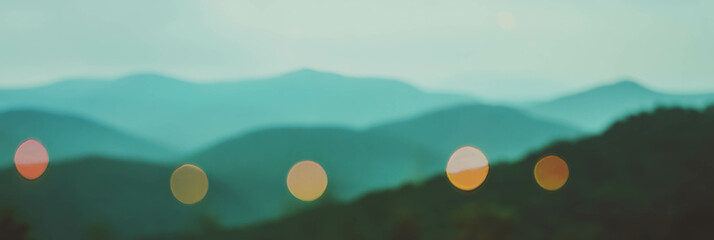 Aufkleber - Blurred mountain landscape with colorful bokeh lights and bright background for depth
