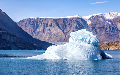 Wall Mural - a blue iceberg in the waters of dickson fjord, northeast greenland national park. the glacier, hangi