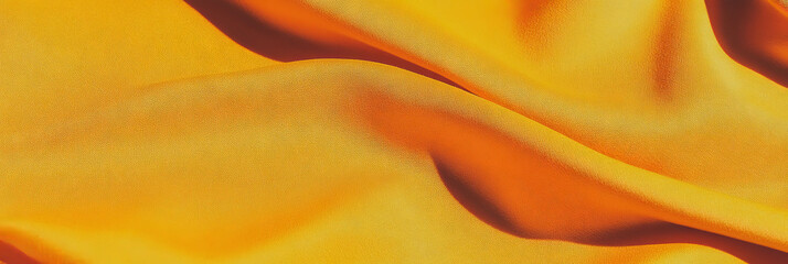 Poster - Bright amber cotton fabric with diagonal pattern creates vibrant background for design projects