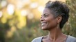 © SHI - A joyful woman smiles warmly, radiating happiness and positivity.