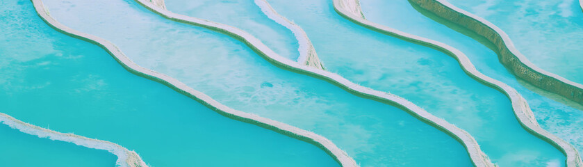Poster - Terraced rice fields showcase distinct levels and vibrant textures under blue skies