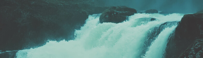 Aufkleber - Cascading waterfall with halftone texture over rocky terrain and grunge background
