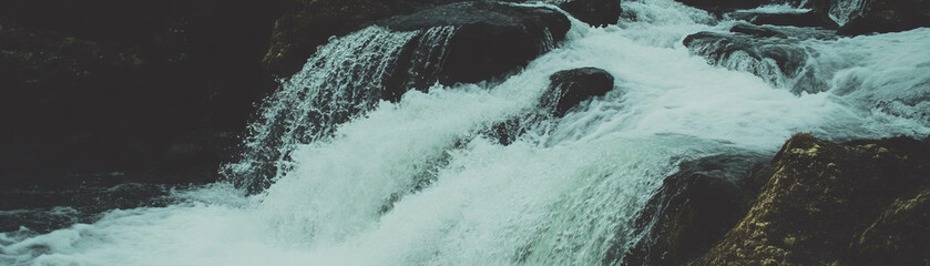 Poster - Halftone texture of cascading waterfall over rugged rocks with grunge effects