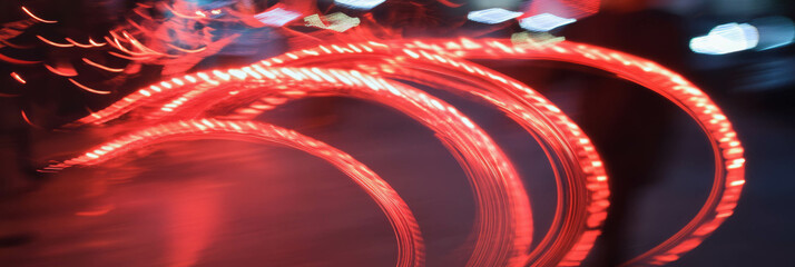 Poster - Swirling red sparks create dynamic patterns in a vibrant urban setting at night