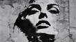 © Marut - and white stencil art of a woman's face with high contrast shadows on a textured concrete wall