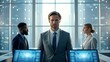© SUPERARTMAN - a serious businessman standing in front of a team in a modern office setting. He is looking directly at the camera with a determined expression while his team looks on with a focused intent.